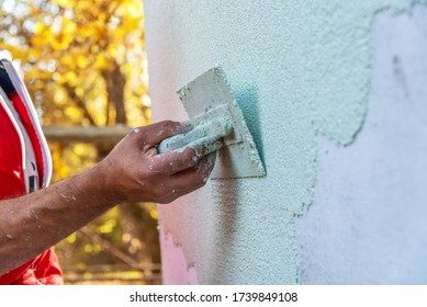 Close-up of stucco crack repair on a wall