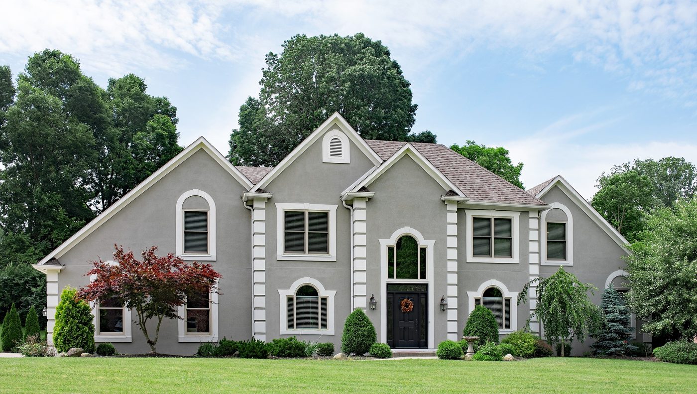 Residential home with finished stucco exterior